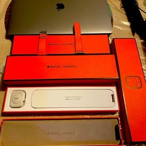Hermes Apple Watch series 8 with Hermes orange leather band.